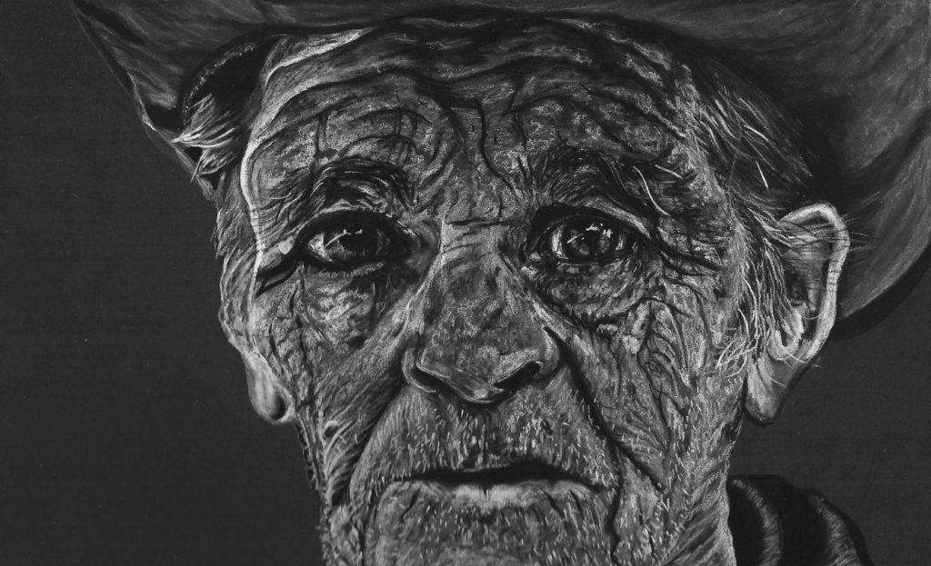 A hand drawn black and white charcoal pencil drawing of an old cowboy man